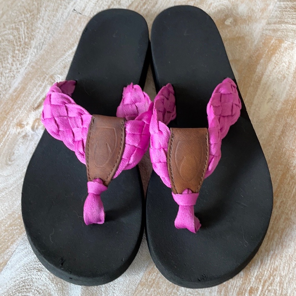 Pink braided flip flops